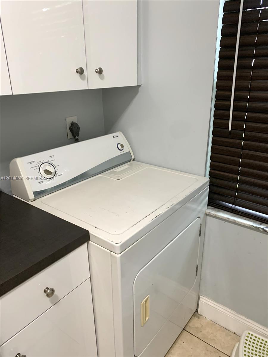 4904 Southwest 139th Court Miami, FL 33175 - Photo 9 of 20 a utility room with dryer and washer