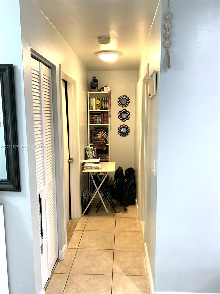 4904 Southwest 139th Court Miami, FL 33175 - Photo 10 of 20 a living room with a rug and a window