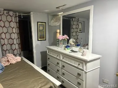 a bathroom with a sink vanity and a mirror