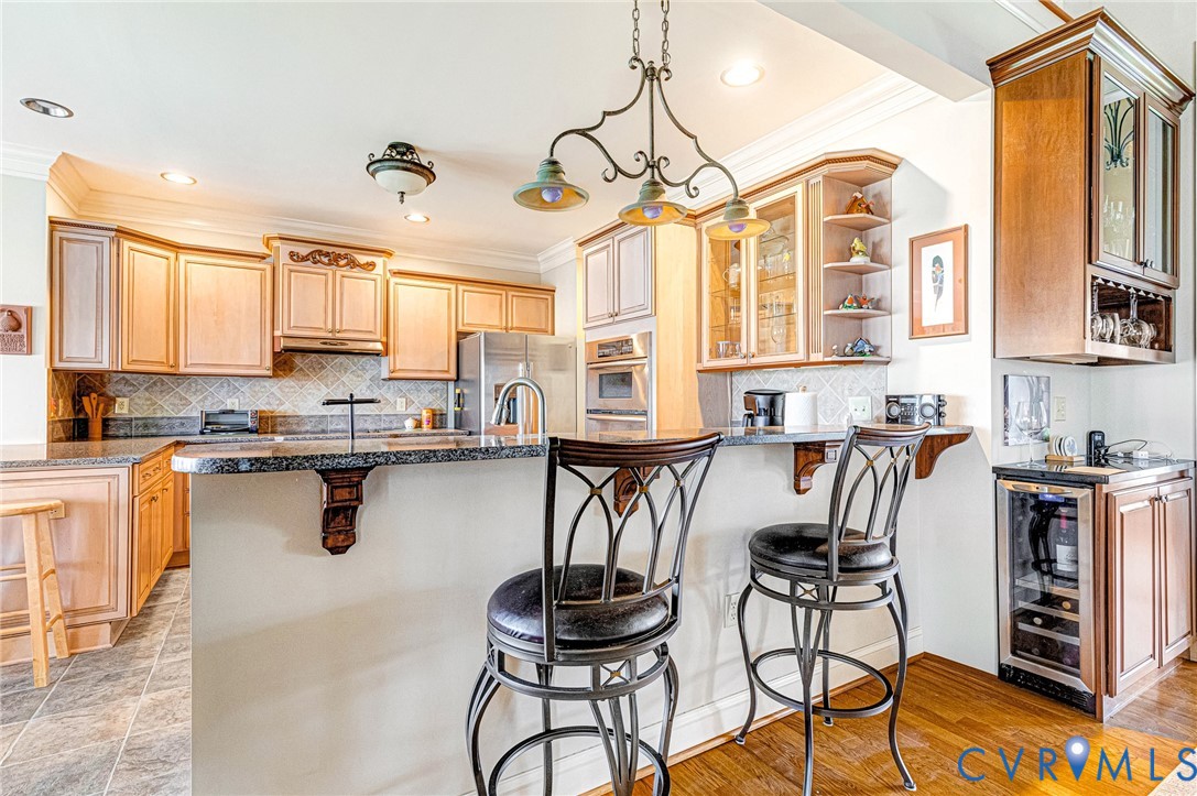 14461 Riverside Drive Ashland, VA 23005 - Photo 14 of 63 Convenient wine cooler located between Family Room