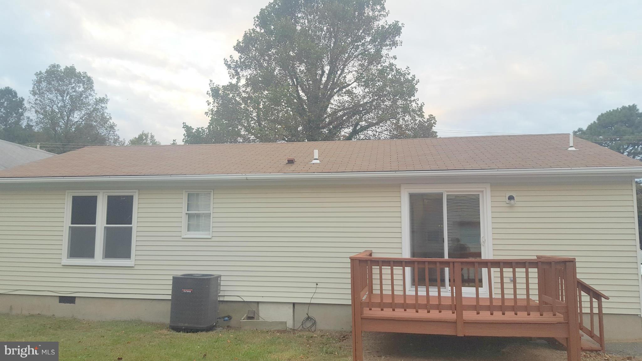 927 Crystal Rock Road Lusby, MD 20657 - Photo 14 of 30 a view of a house with a deck