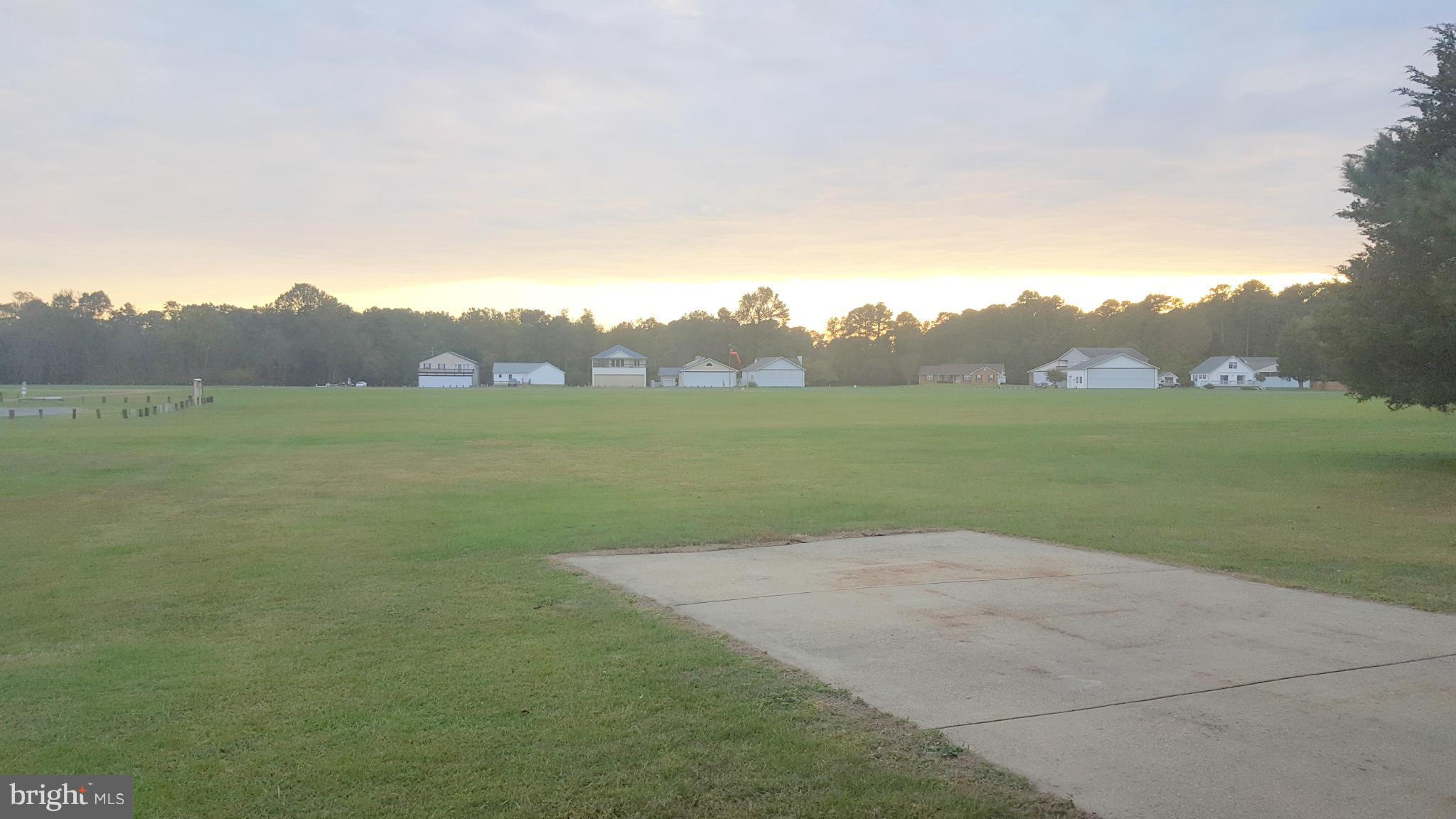 927 Crystal Rock Road Lusby, MD 20657 - Photo 17 of 30 a view of a field with an ocean