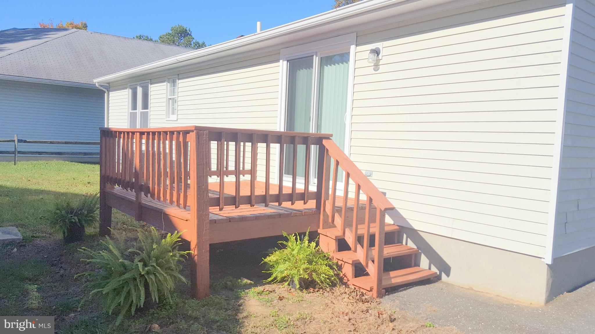 927 Crystal Rock Road Lusby, MD 20657 - Photo 26 of 30 a view of a porch with a bench