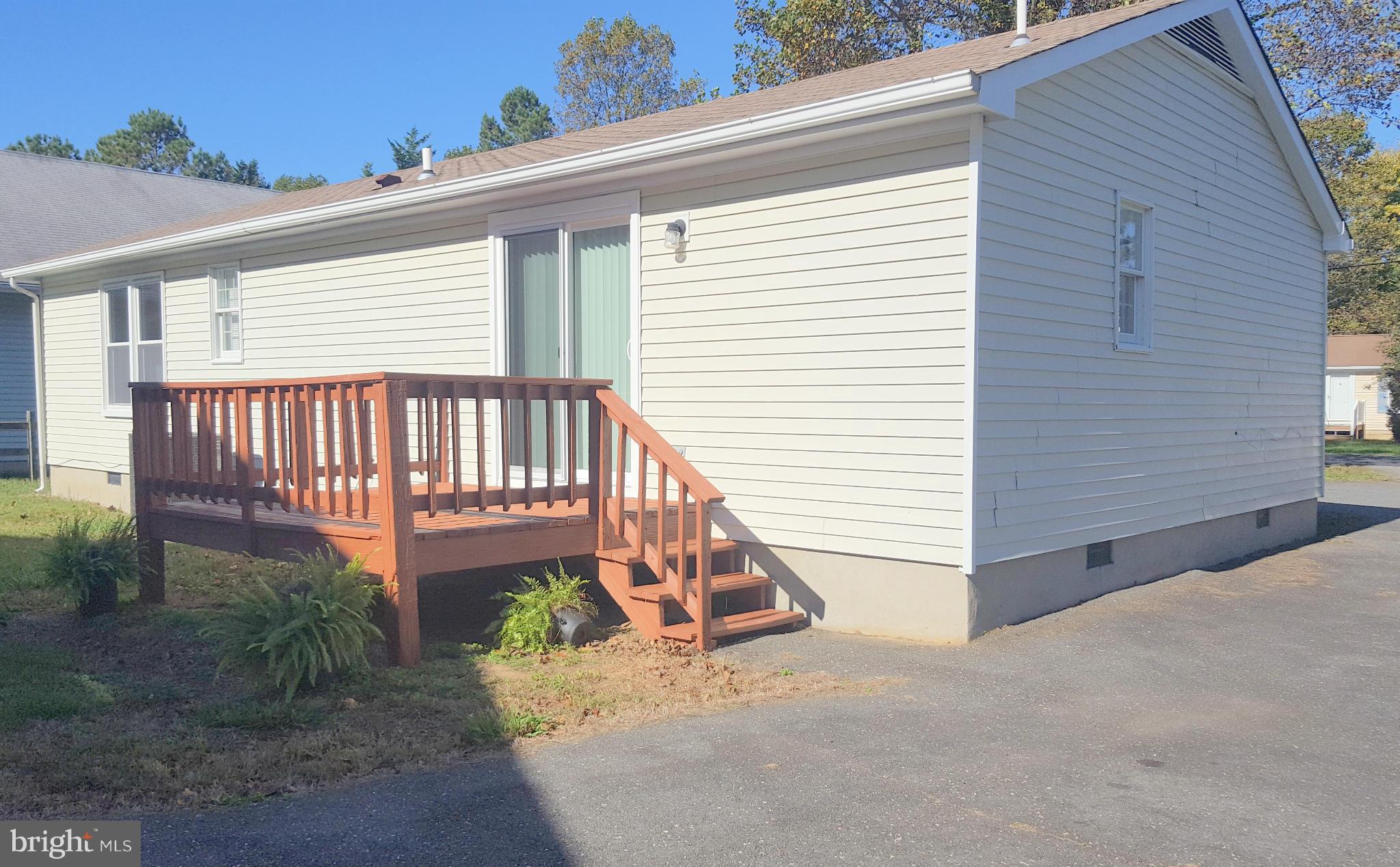 927 Crystal Rock Road Lusby, MD 20657 - Photo 29 of 30 a view of a deck with a bench