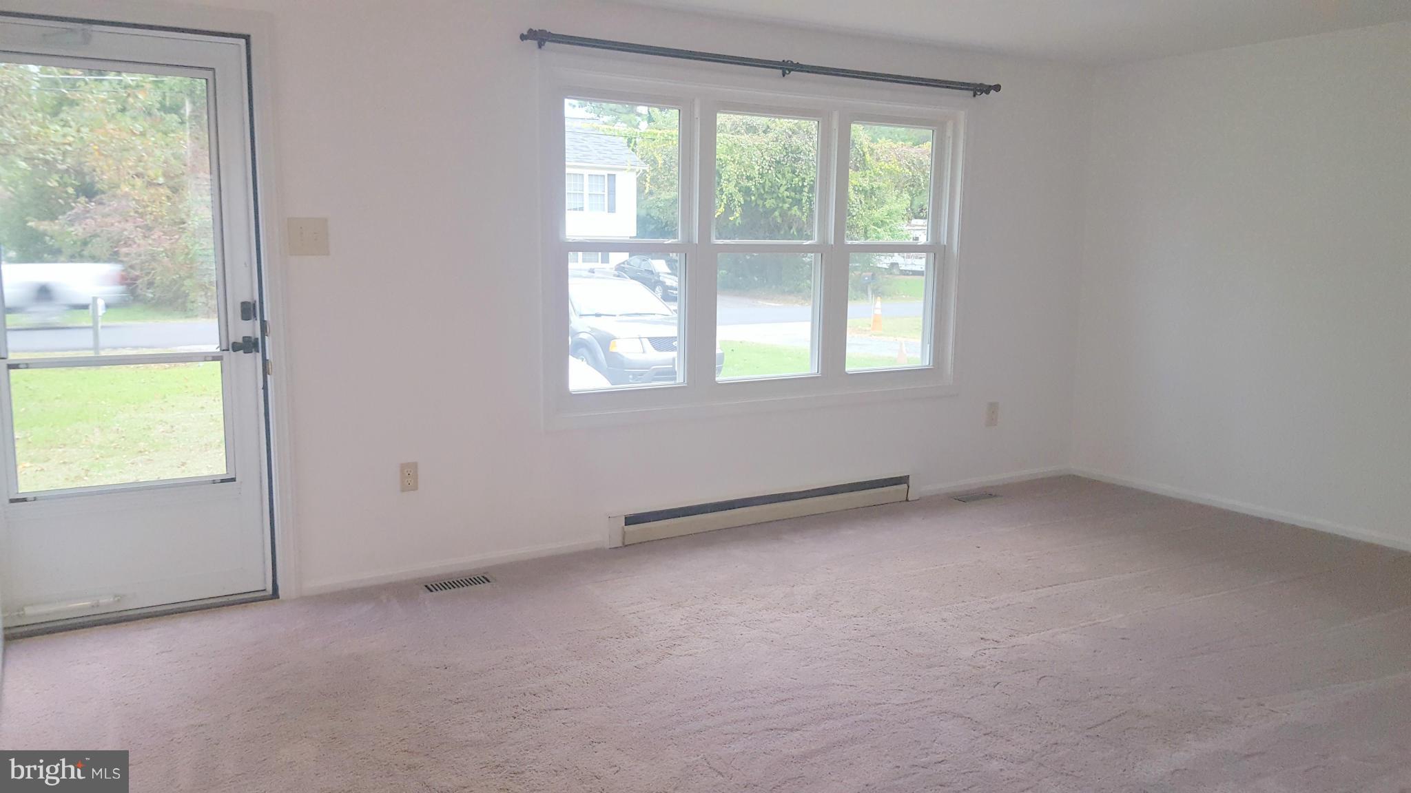 927 Crystal Rock Road Lusby, MD 20657 - Photo 7 of 30 an empty room with a window