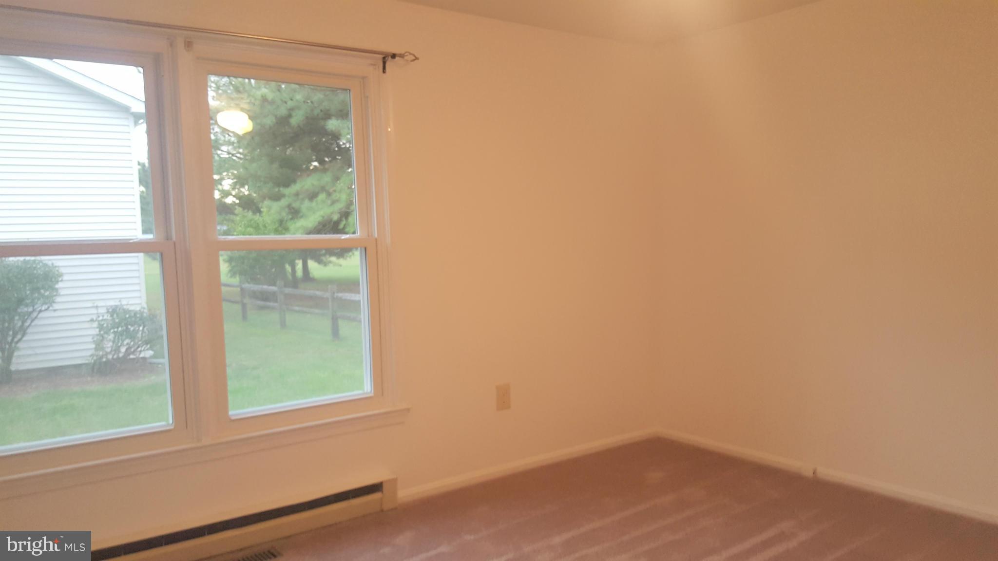 927 Crystal Rock Road Lusby, MD 20657 - Photo 8 of 30 an empty room with a window