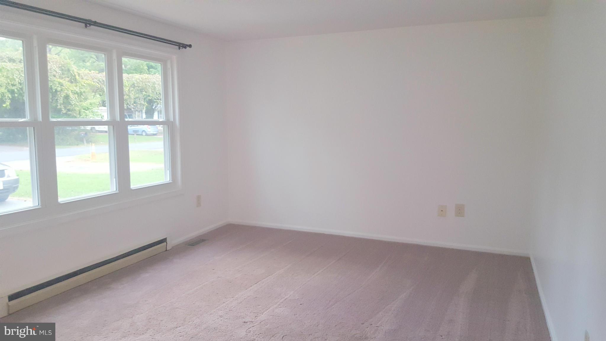 927 Crystal Rock Road Lusby, MD 20657 - Photo 10 of 30 a view of an empty room with a window