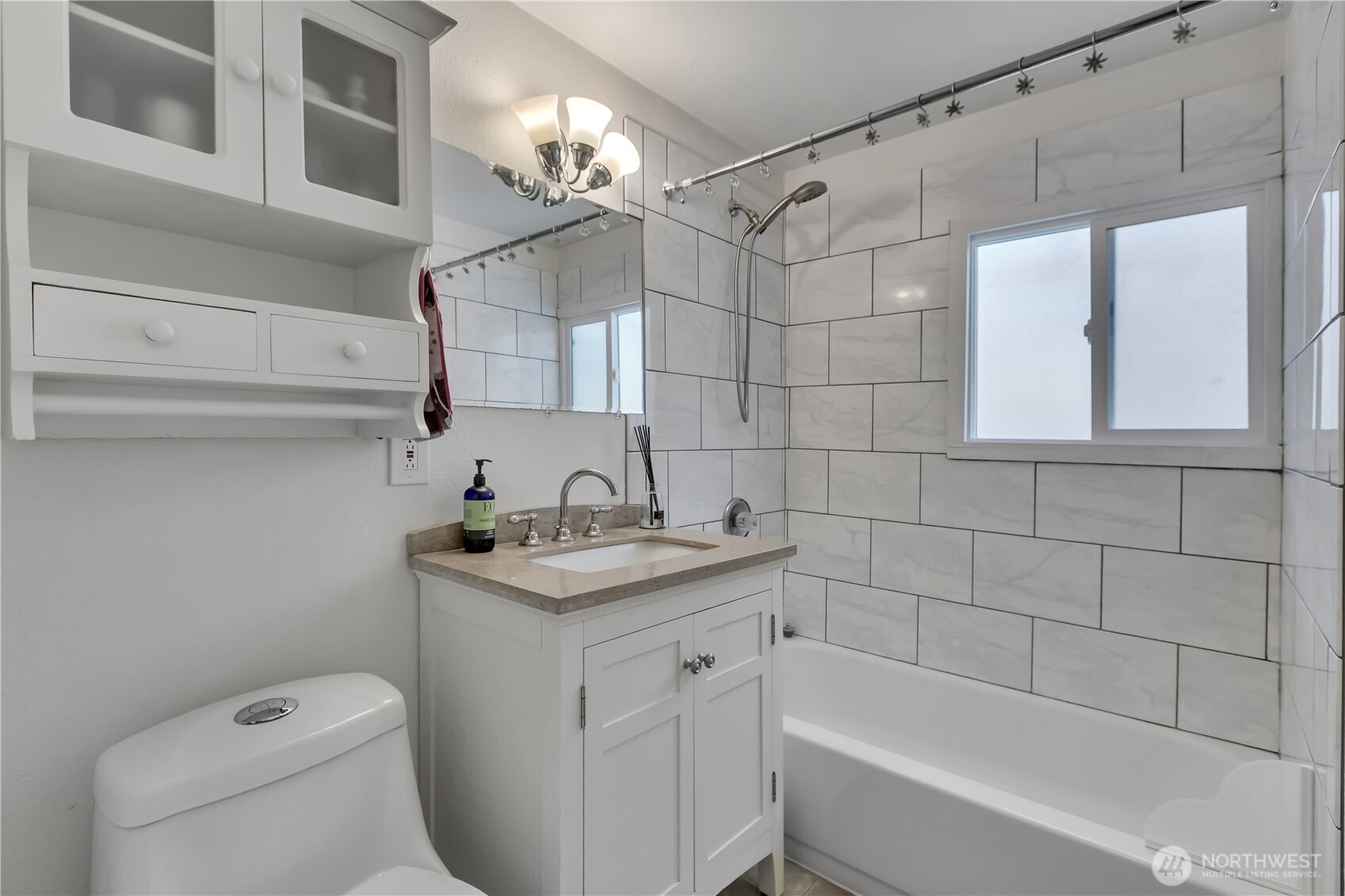 2307 Southwest Myrtle Street Seattle, WA 98106 - Photo 15 of 30 a bathroom with a sink a toilet and shower