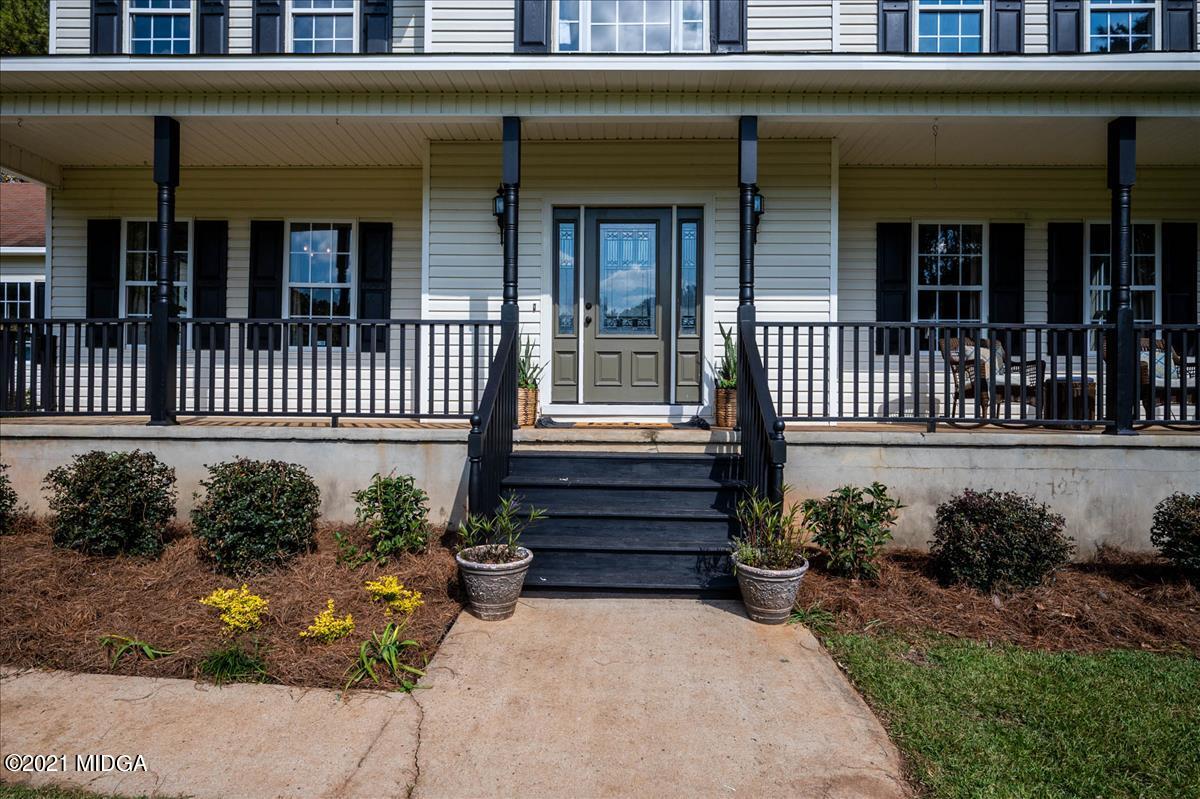1884 Maynards Mill Road Forsyth, GA 31029 - Photo 8 of 65 a front view of a house