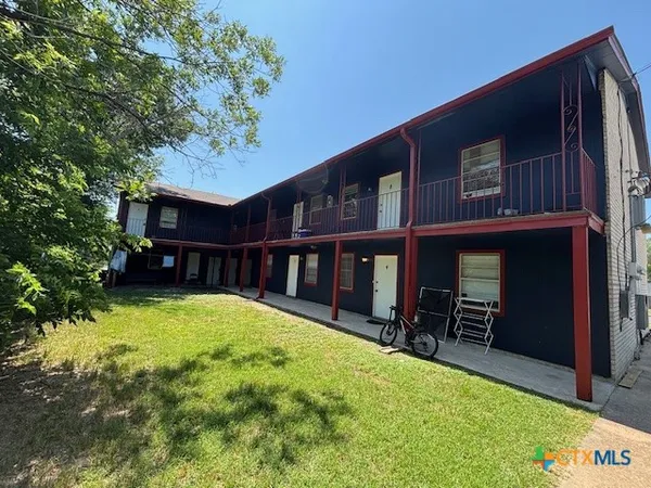 a view of house with yard and entertaining space