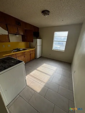 a view of kitchen and utility room