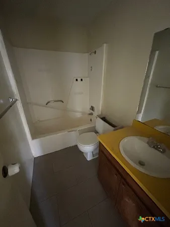 a bathroom with a sink and toilet