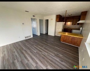 410 Veterans Avenue, Unit 5 Copperas Cove, TX 76522 - Photo 7 of 7 a view of room with wooden floor