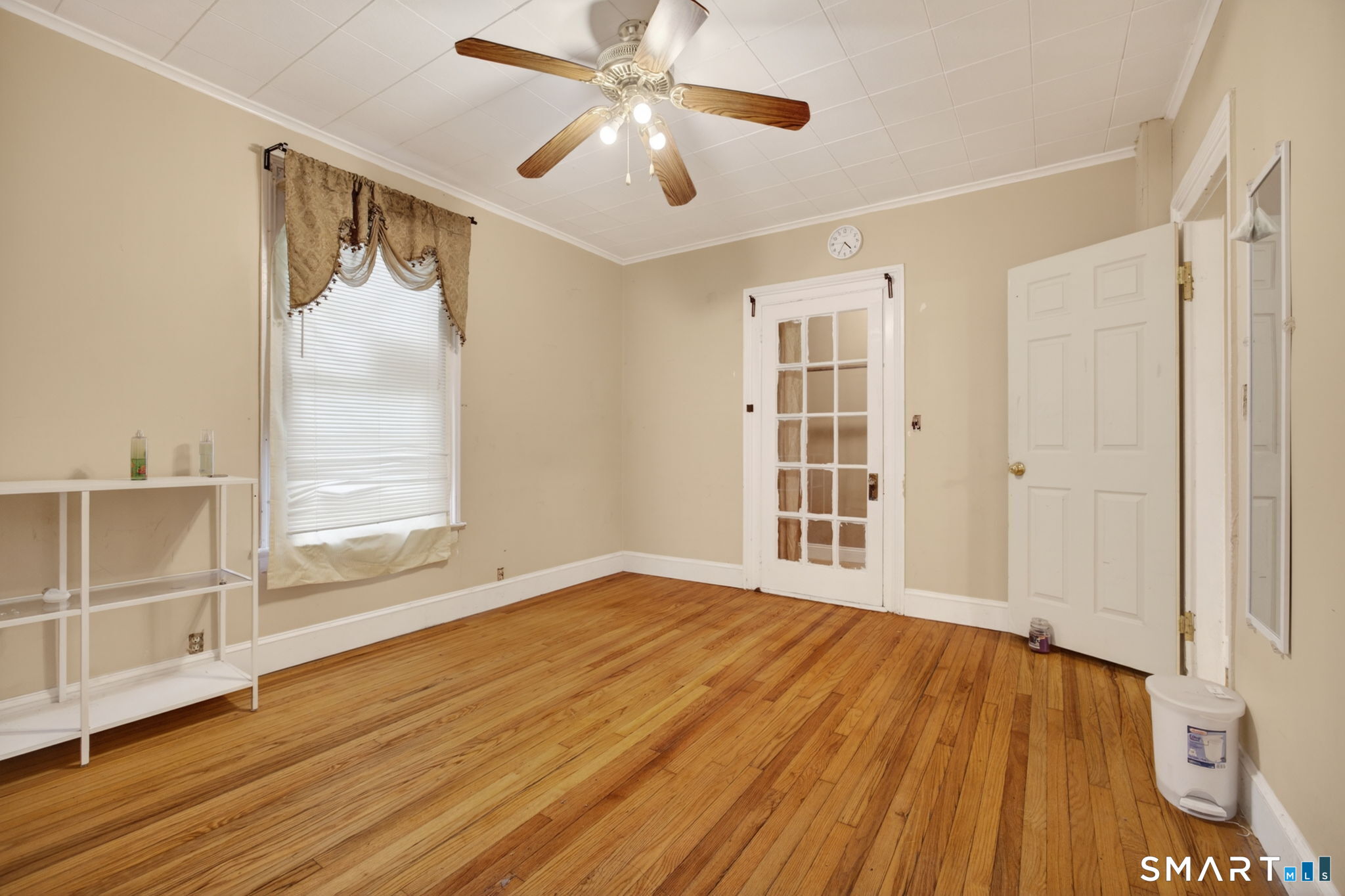 670 Hanover Road Meriden, CT 06451 - Photo 22 of 40 a view of an empty room with wooden floor and a window