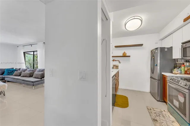 a bedroom with a bed and a view of bedroom