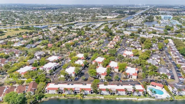 an aerial view of a house with a yard and a garden