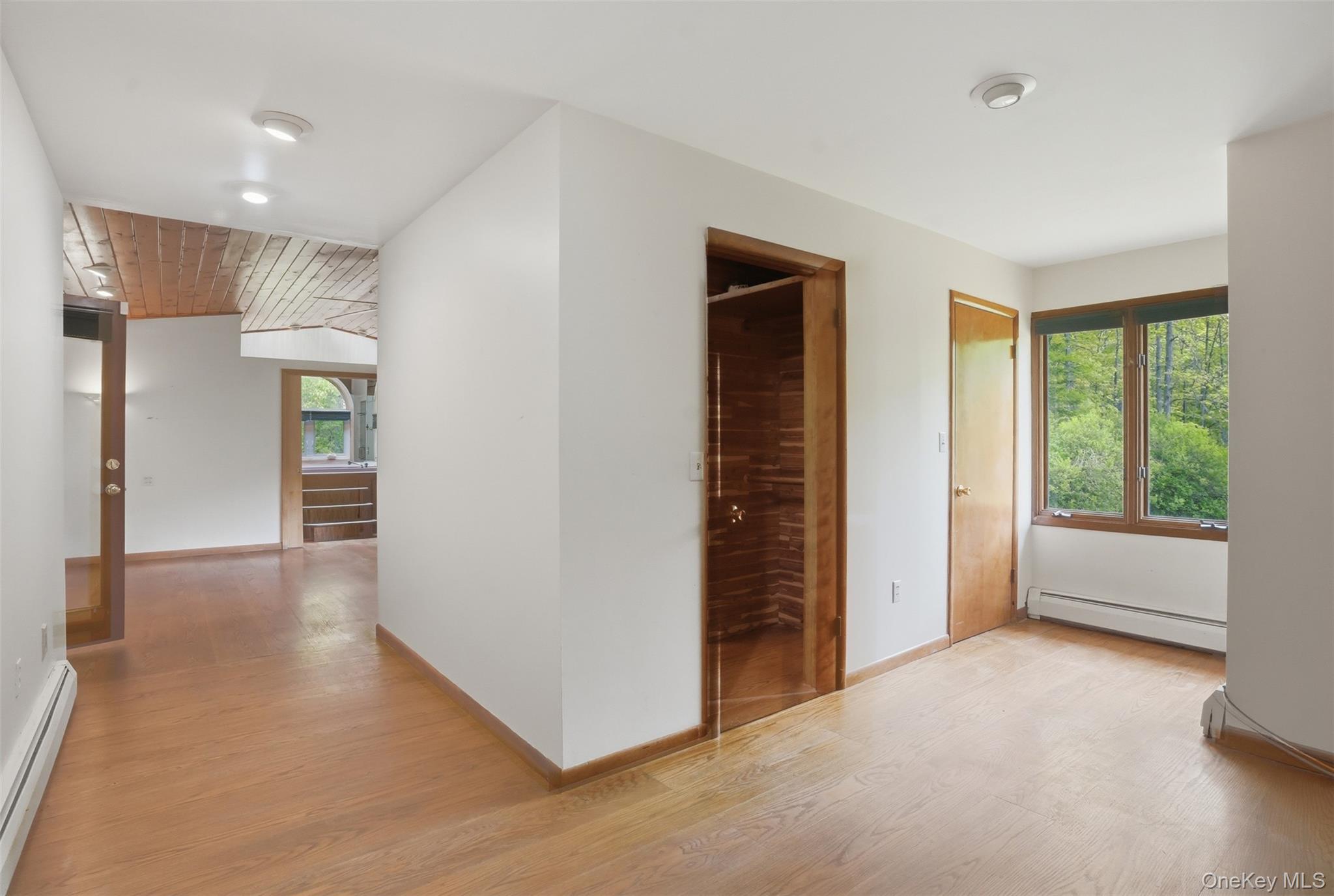 435 Samsonville Road Kerhonkson, NY 12446 - Photo 21 of 37 a view of a livingroom with an empty space and a window