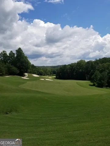 a view of a golf course with a lake