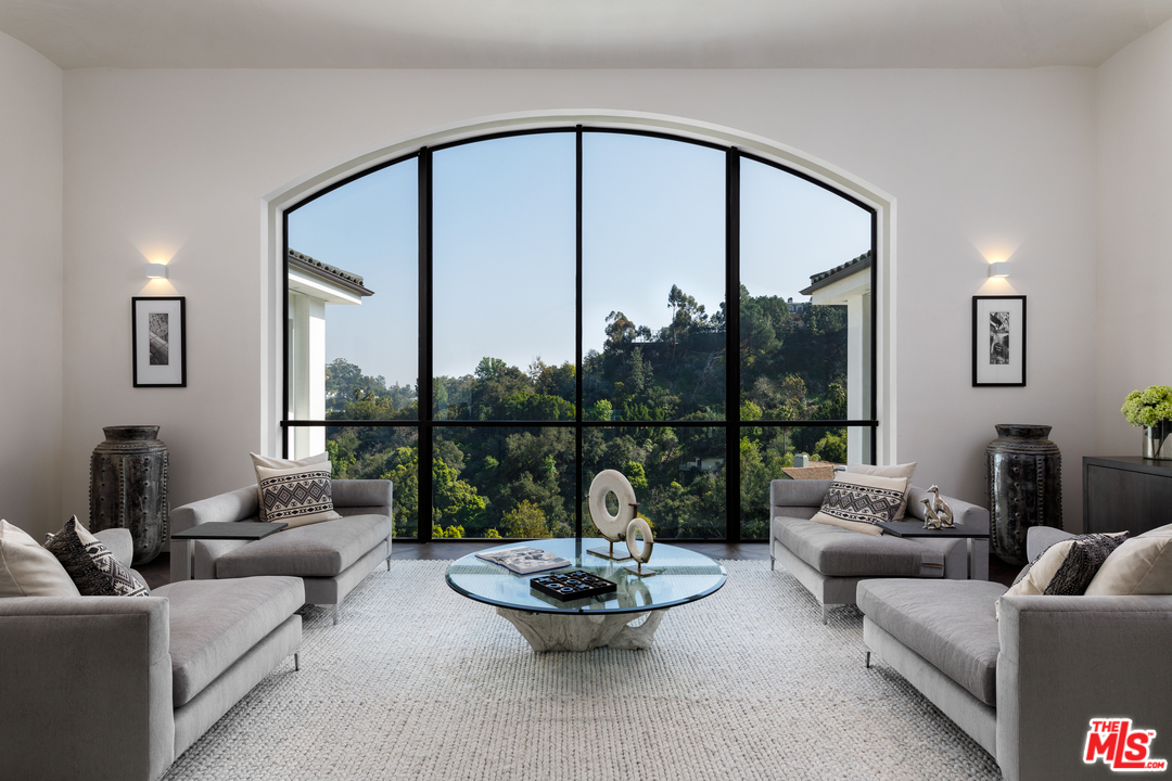 10697 Somma Way Los Angeles, CA 90077 - Photo 11 of 25 a living room with furniture and a large window