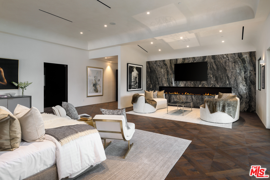 10697 Somma Way Los Angeles, CA 90077 - Photo 12 of 25 a living room with furniture and a flat screen tv