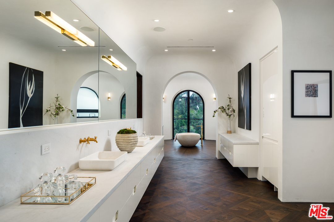 10697 Somma Way Los Angeles, CA 90077 - Photo 13 of 25 a living room with furniture and a mirror