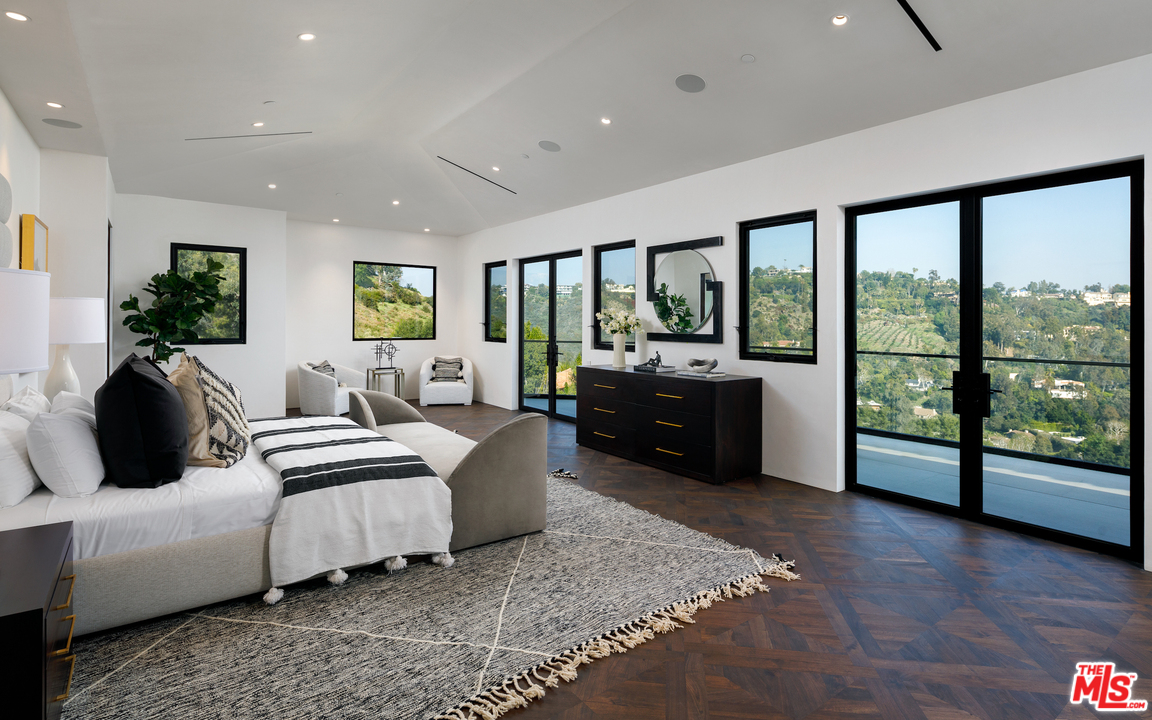 10697 Somma Way Los Angeles, CA 90077 - Photo 15 of 25 a living room with furniture and a large window