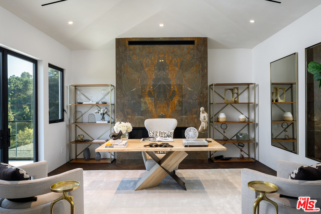 10697 Somma Way Los Angeles, CA 90077 - Photo 16 of 25 a living room with furniture and a large window
