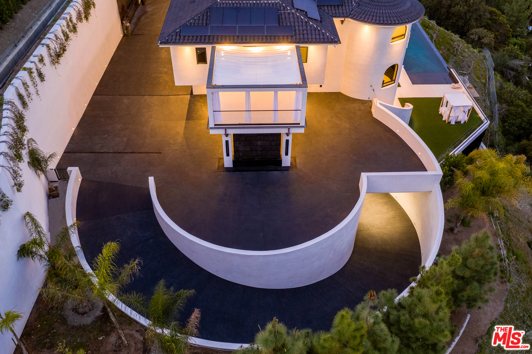 10697 Somma Way Los Angeles, CA 90077 - Photo 4 of 25 an aerial view of a house with swimming pool