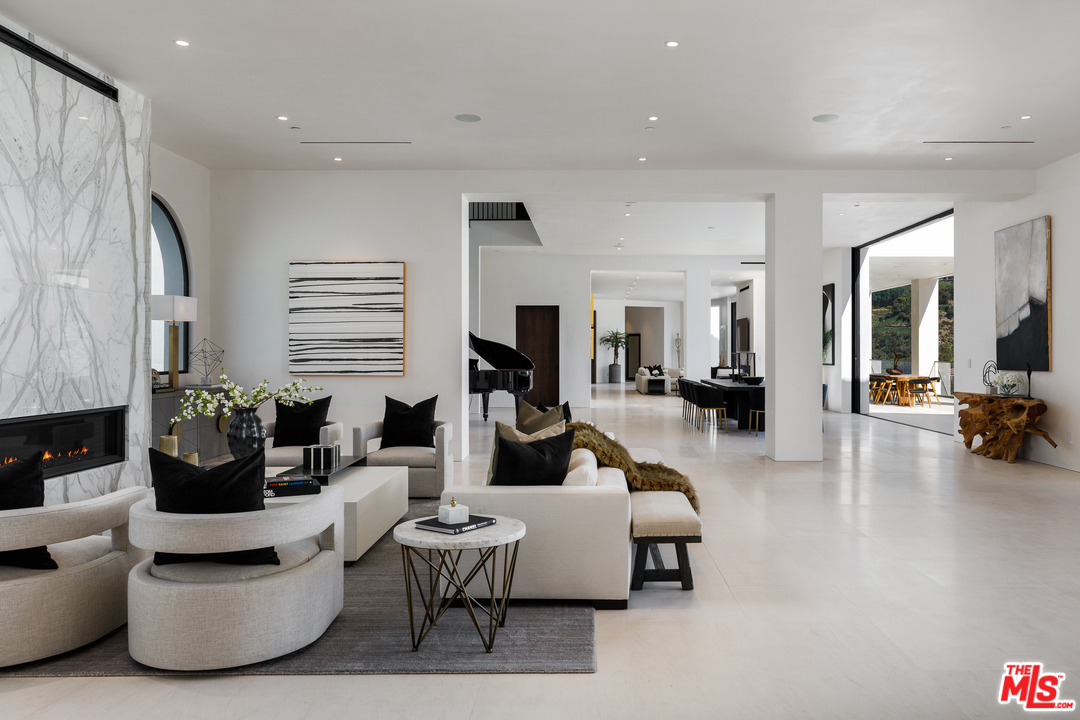 10697 Somma Way Los Angeles, CA 90077 - Photo 5 of 25 a living room with furniture and a large window