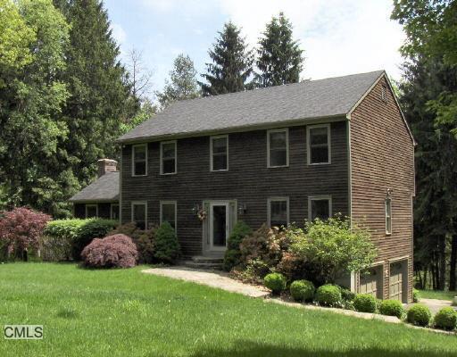 135 Currituck Road Newtown, CT 06470 - Photo 1 of 1 a front view of a house with a garden