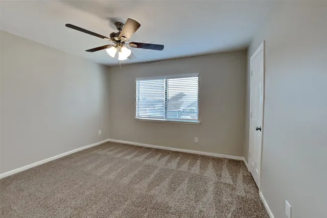 a white bath tub sitting next to a white toilet and a shower