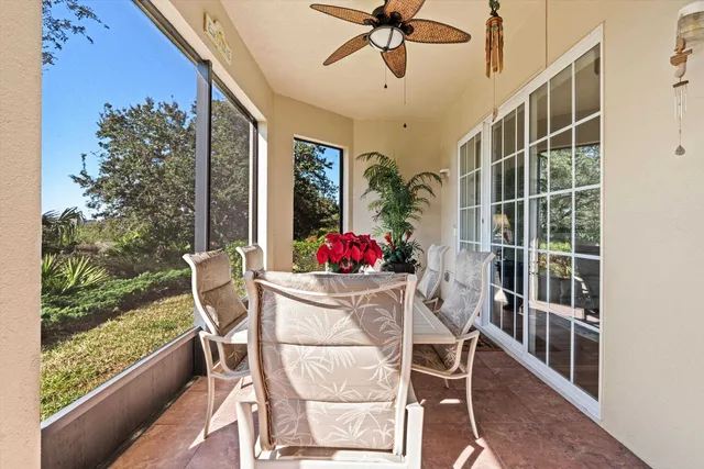 a dining room with furniture and garden view