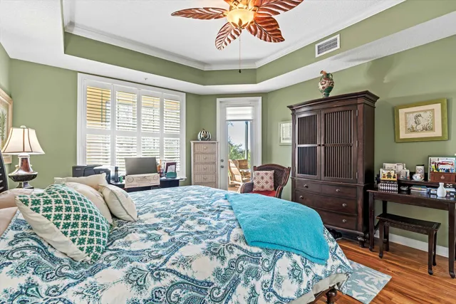 a bedroom with a bed a couch and dresser