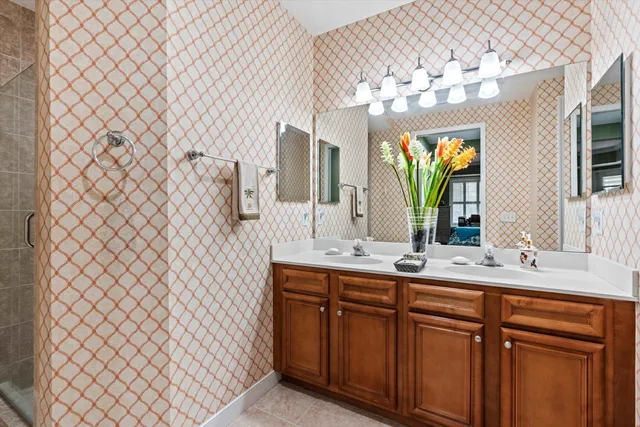 a bathroom with a sink vanity and mirror