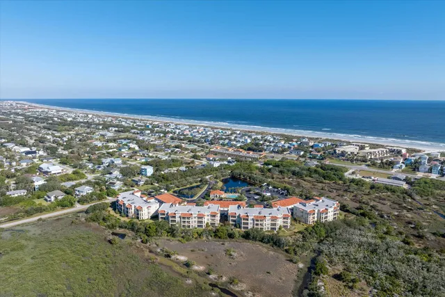 a couple of cars parked in front of a house