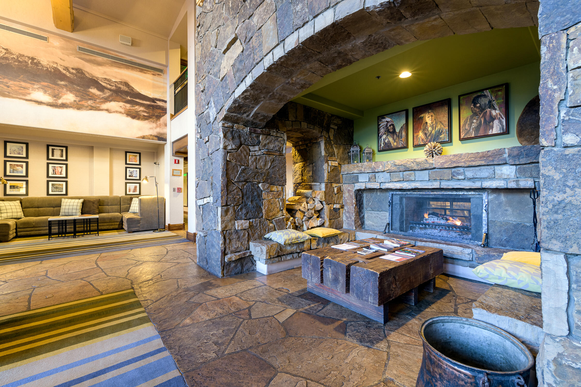 567 Mountain Village Boulevard, Unit DEED Mountain Village, CO 81435 - Photo 6 of 9 a living room with furniture and a fireplace