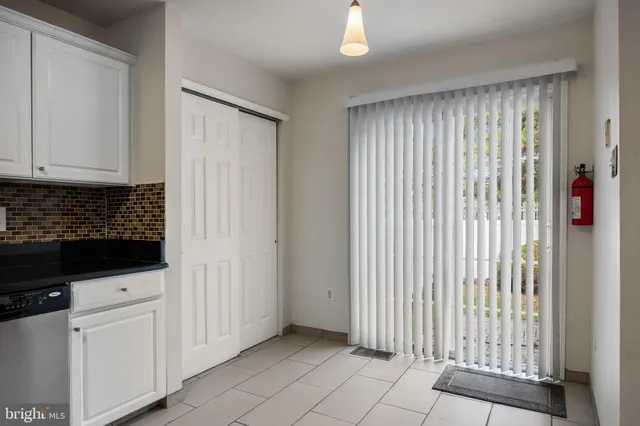 a view of a livingroom with an empty space and a window