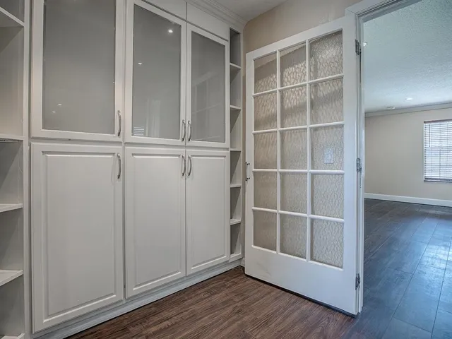 a bathroom with a granite countertop sink a large mirror and shower