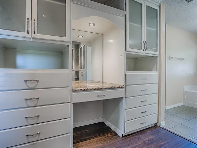 a spacious bathroom with a tub shower and sink