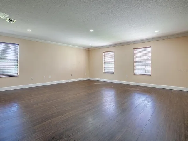 a kitchen with white cabinets stainless steel appliances and sink