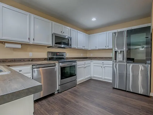 a view of entryway with wooden floor