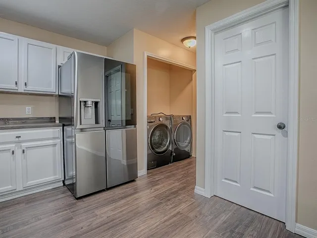 a view of entryway with wooden floor