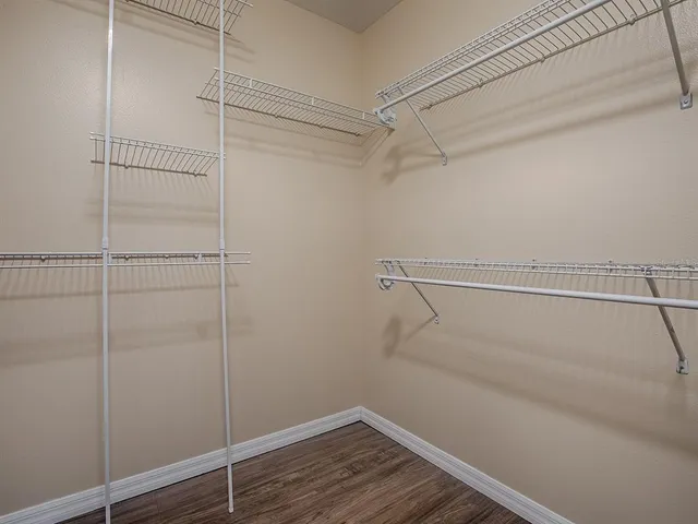 an aerial view of a house with a garden and a yard