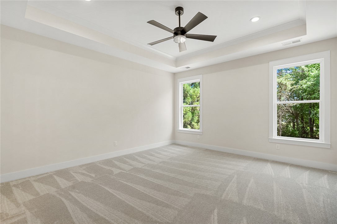 100 Garden Gate Drive Anderson, SC 29621 - Photo 20 of 43 This spacious bedroom offers ample natural light and a comfortable atmosphere for rest and relaxation.