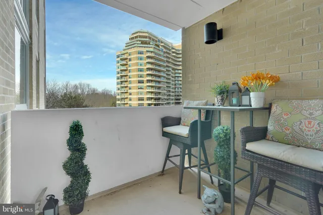 a dining room with furniture and a window