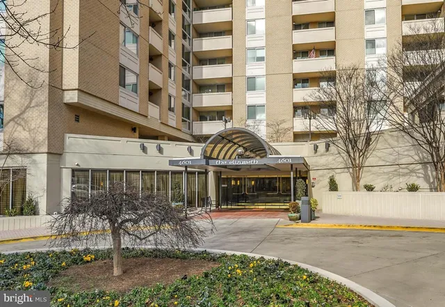 front view of a building with a garden