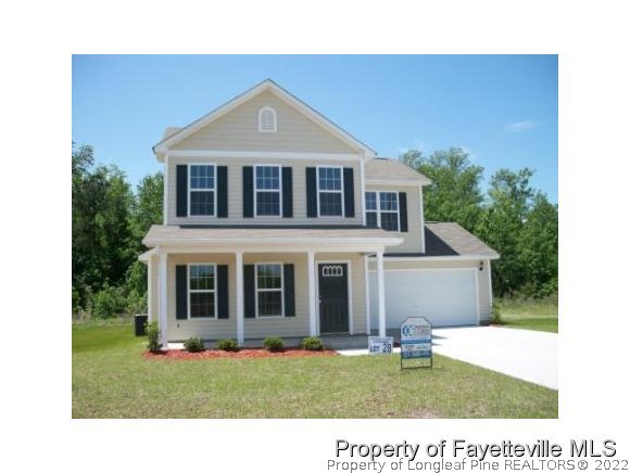 344 Cape Fear Road Raeford, NC 28376 - Photo 1 of 12 a front view of a house with a yard
