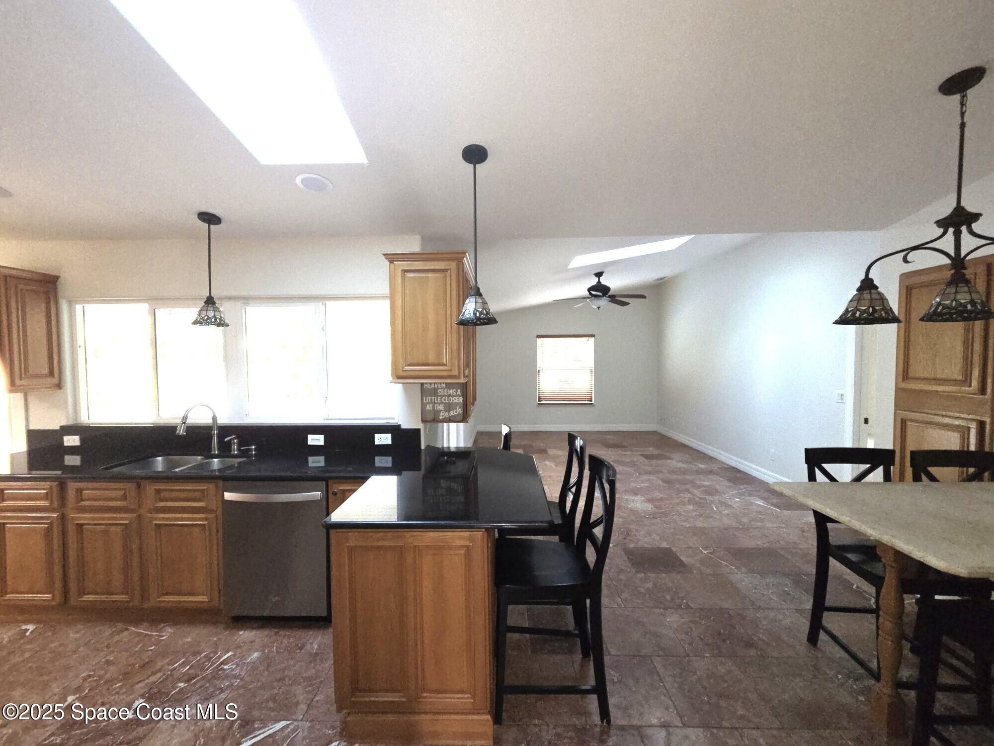 190 Sea Crest Drive Melbourne Beach, FL 32951 - Photo 6 of 16 Kitchen & Family Room