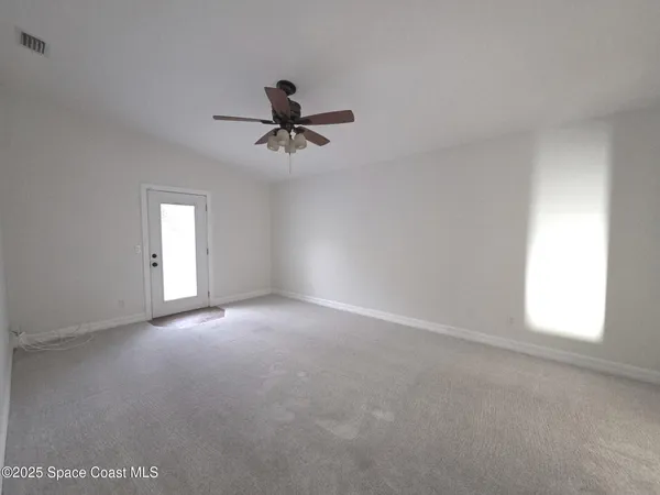 a view of empty room with windows