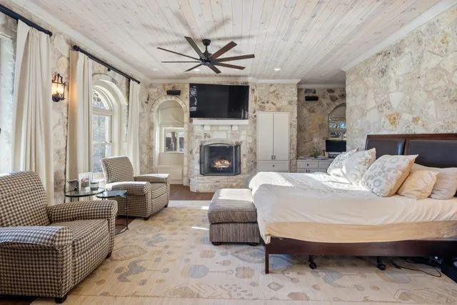 a bedroom with furniture and a book shelf